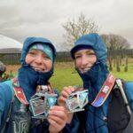 Kate Townsend (left) and Colette Grist posing with their medals after the 2025 South Downs Trail ultra