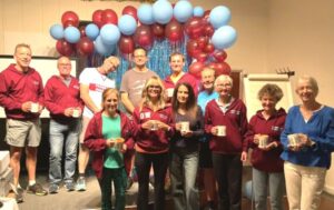 Group of members who qualified for a HRRL mug by completing at least 7 of the league races at the 2025 Farnham Runners AGM and awards evening