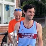 Joe Collins with the senior mens and overall champion trophy and shield at the 2025 Club Championship