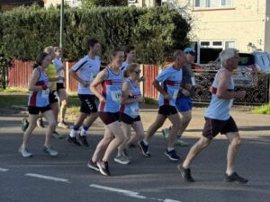 Farnham Runners running shortly after the start the 2025 Elstead marathon