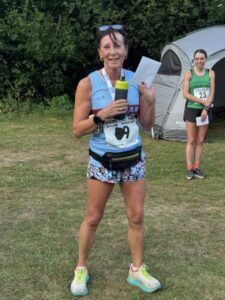 Kay Copeland her 1st F65 prize at the 2025 Gibbet Hill 10k