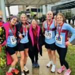 Small group of Farnham Runners team members with their medals after the 2025 HRRL Victory 5 race