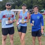 Farnham Runners with their trophies at the Farnham Pilgrim half marathon, Joe Muntean-Lee (left), Lizzie May (centre) and Joe Collins (right)