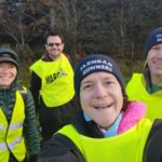 Some of the Farnham Runners volunteers in Hi-Viz tabards before the start of the 2025-26 SXCL Alice Holt cross country