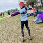 A muddy Gabi Hitchcock after the 2025 SXCL Lord Wandsworth cross-country race