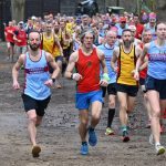 Alex Elsey and Lizzie May running at the front of the pack at the 2026 SXCL race in the Bourne Woods in Farnham