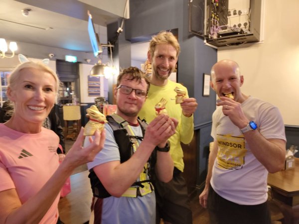 The winning team of the 2026 Farnham Runners Easter run with chocolate easter bunny prizes, left to right Georgie Abrook, Jonathan Tyler, Dave Royse and Steve Bailey