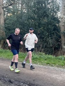 Farnham Runner Joe Muntean Lee on the right running in the 2026 Lone Wolf 'backyard ultra' in Alice Holt Forest