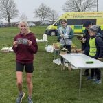 Georgi Abrook receiving her prize after the 2026 SXCL Solent half marathon