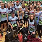 Farnham Runners men and ladies team posing in the sports hall before the 2026 Stubbington Green 10km