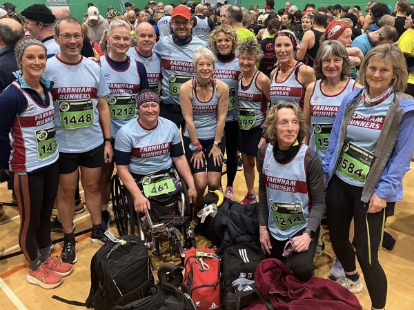 Farnham Runners men and ladies team posing in the sports hall before the 2026 Stubbington Green 10km