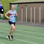 James Goodwin running on the athletics track near the finish of the 2026 HRRL Salisbury 10