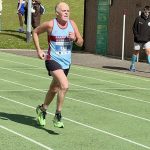 Justin Clarke running on the athletics track near the finish of the 2026 HRRL Salisbury 10
